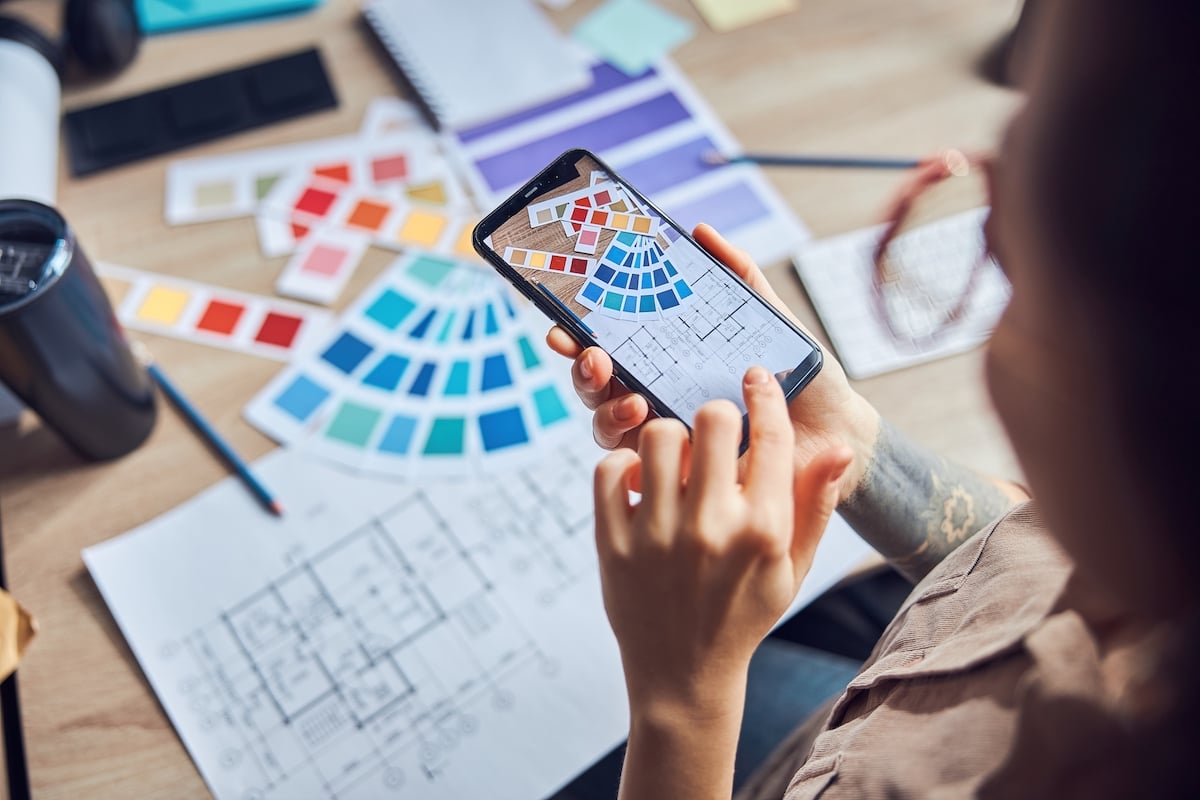 Image of an iphone taking a picture of a blueprint