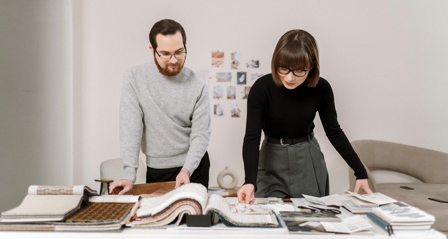 Dealer designers looking at samples in an commercial design firm office 