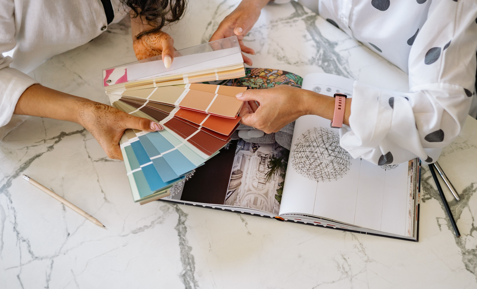 Interior designers looking at product samples to select for an interior design project 